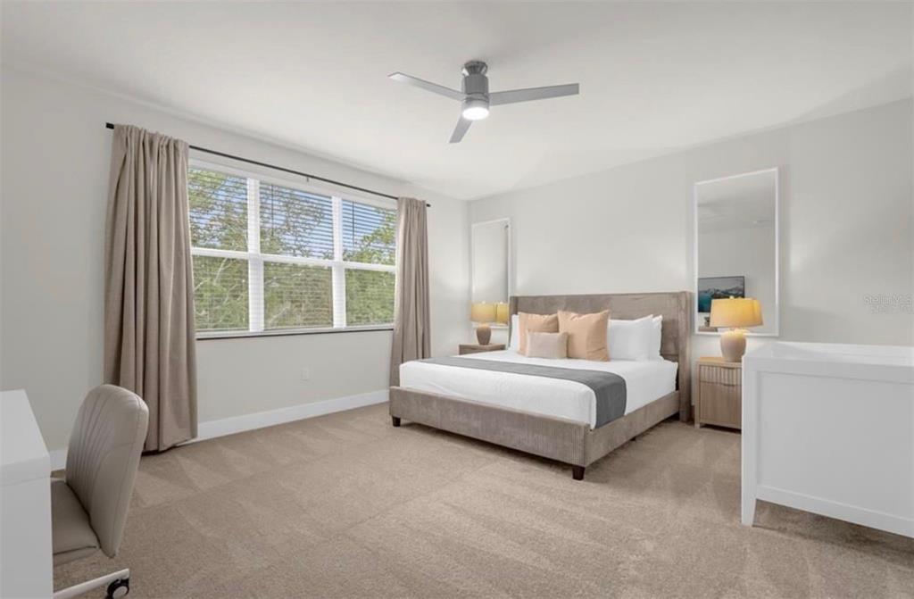 1411 Serendipity Lane Clermont, FL 34714 - Photo 9 of 15 a bed room with a bed and a chair