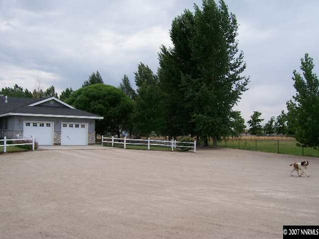3368 Rice Road Fallon, NV 89406 - Photo 3 of 6 a view of house with outdoor space and trees in the background