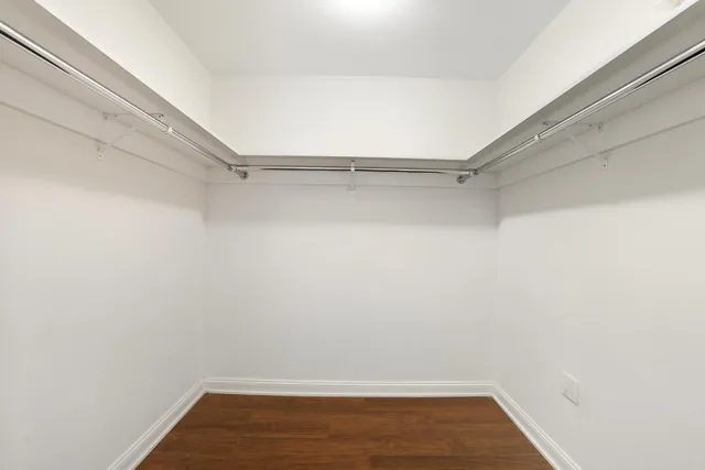 a workspace with furniture a rug and wooden floor