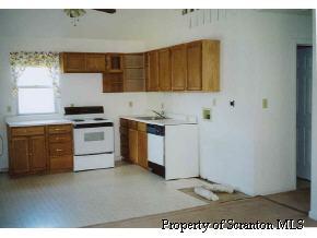 169 Janes Road Union Dale, PA 18470 - Photo 2 of 4 a kitchen with a sink a stove and cabinets
