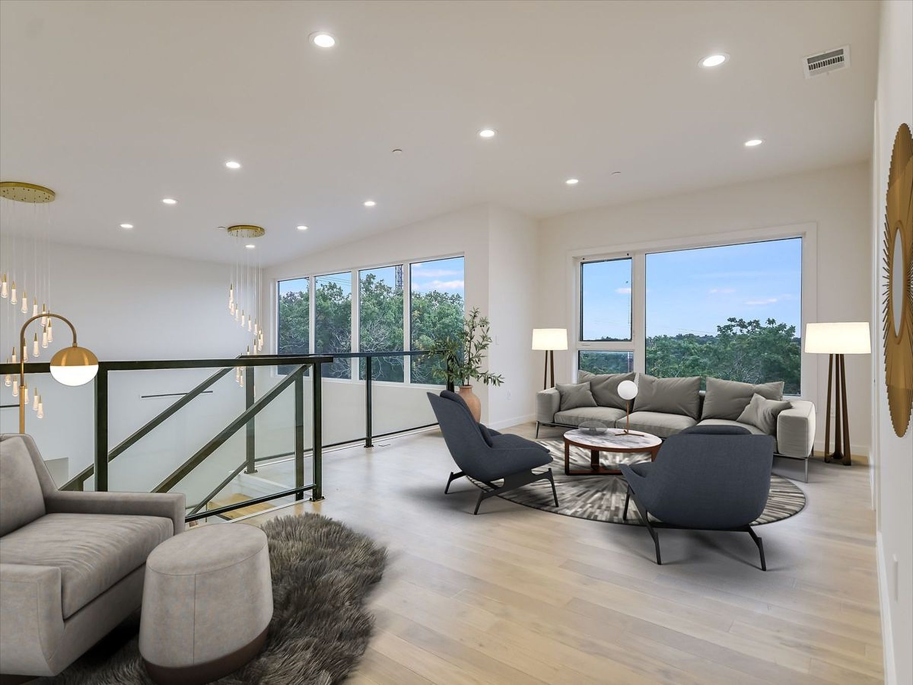 2476 Waymaker Way Austin, TX 78746 - Photo 16 of 31 Natural light pours into this living space, revealing polished hardwood flooring and abundant recessed lighting.