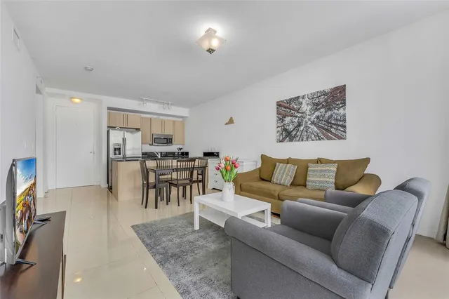 a living room with furniture and a table