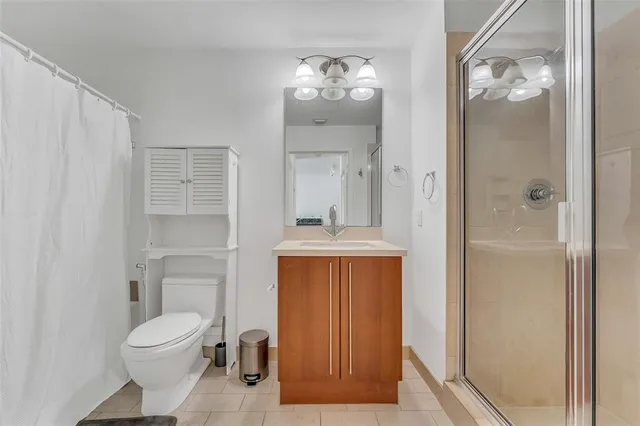 a bathroom with a sink a toilet and a bathtub