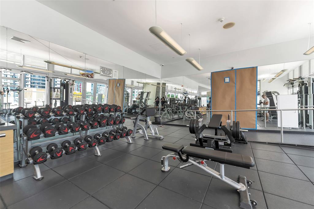 1111 Southwest 1st Avenue, Unit 1224N Miami, FL 33130 - Photo 30 of 37 a living room with lots of furniture and a chandelier