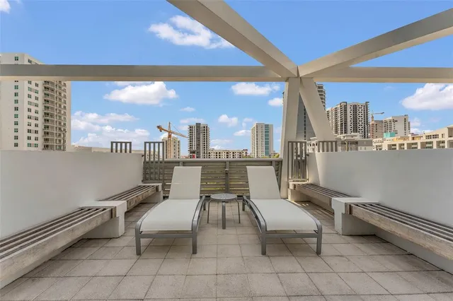 a view of a swimming pool with a lounge chairs