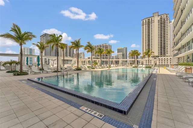 a house view with a sitting space and garden
