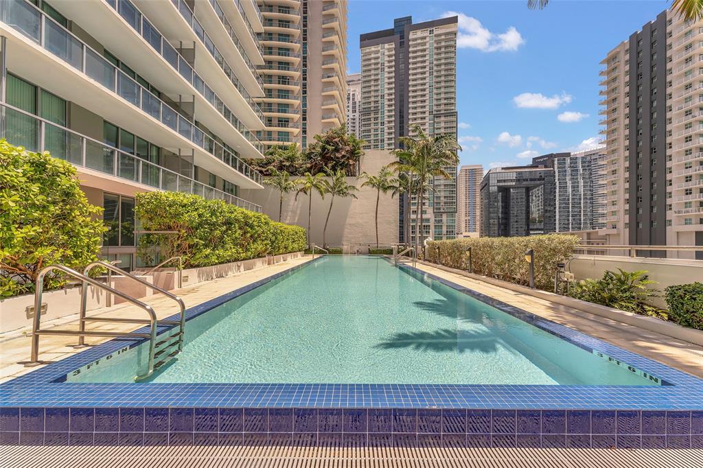 1111 Southwest 1st Avenue, Unit 1224N Miami, FL 33130 - Photo 36 of 37 a view of a swimming pool with a chairs