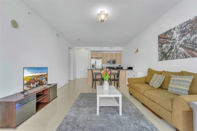 a room with table chairs and wooden floor