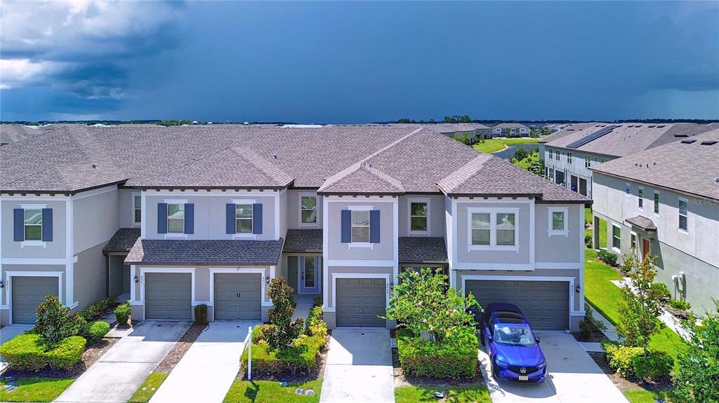 8069 Rolling Shell Trail Wesley Chapel, FL 33545 - Photo 19 of 26 front view of a house with a yard