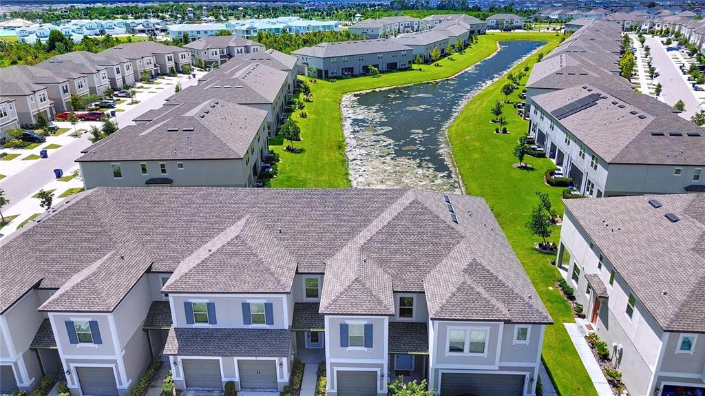 8069 Rolling Shell Trail Wesley Chapel, FL 33545 - Photo 20 of 26 an aerial view of a house with a swimming pool