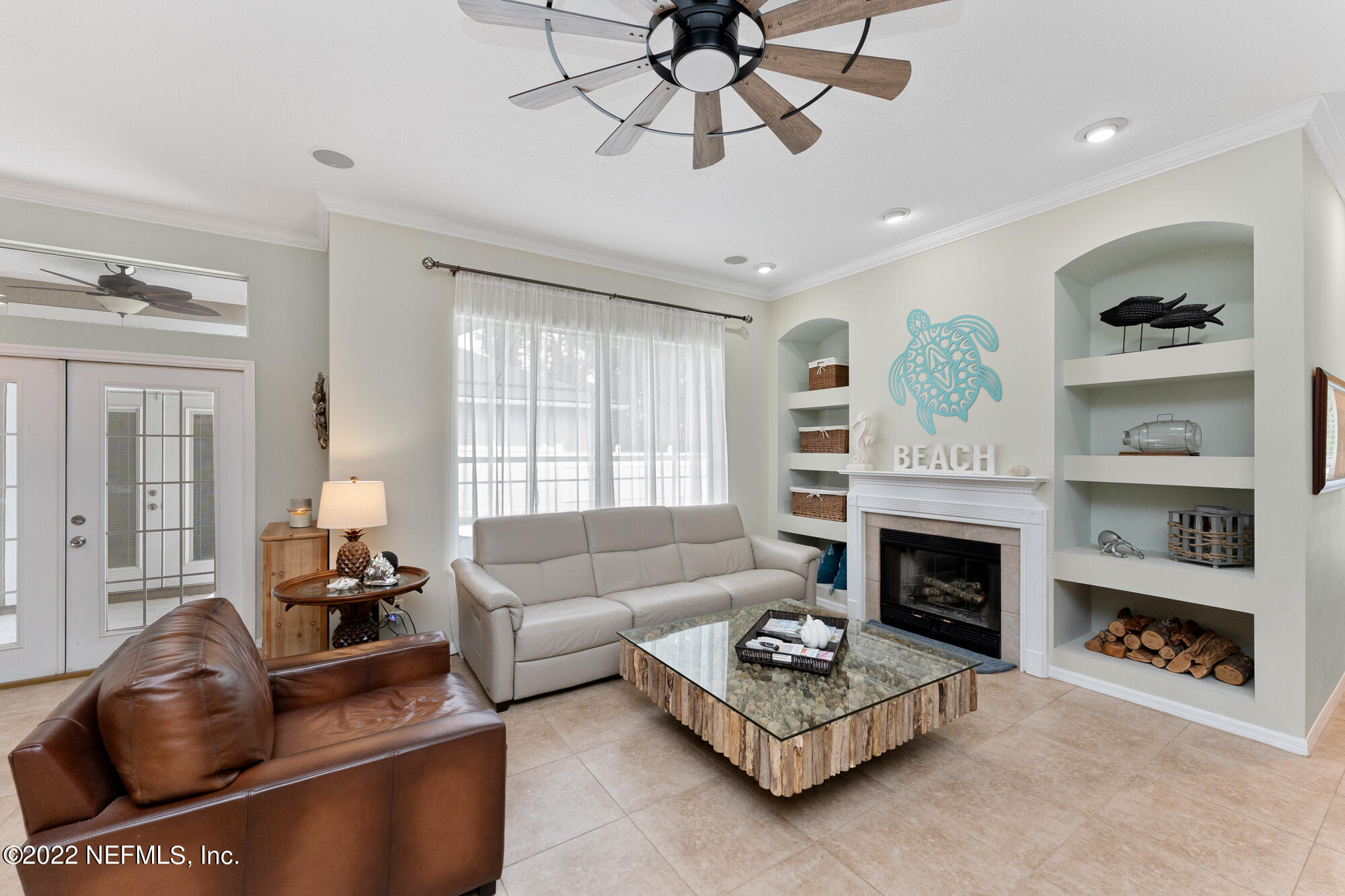8713 Reedy Branch Drive Jacksonville, FL 32256 - Photo 14 of 38 a living room with furniture and a fireplace