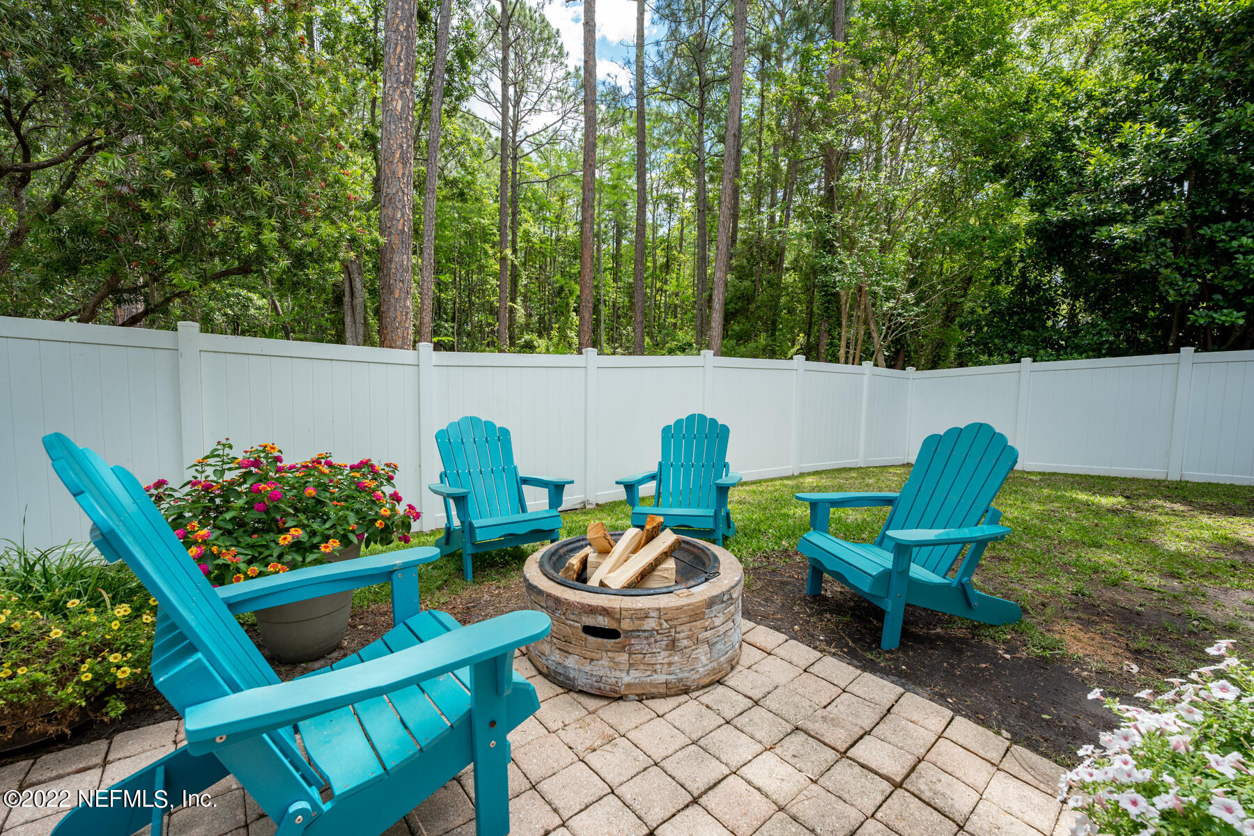 8713 Reedy Branch Drive Jacksonville, FL 32256 - Photo 18 of 38 a view of a chairs and table in backyard