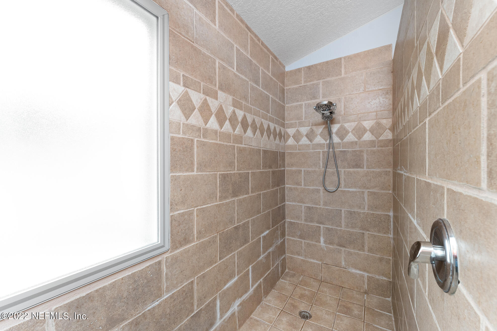 8713 Reedy Branch Drive Jacksonville, FL 32256 - Photo 23 of 38 a bathroom with a shower
