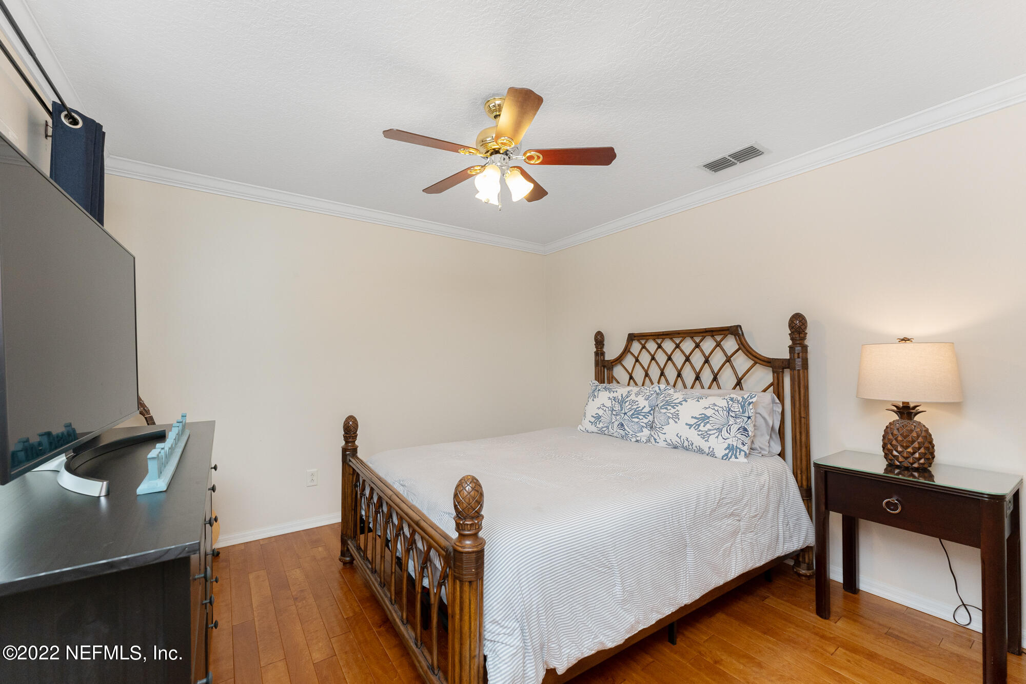 8713 Reedy Branch Drive Jacksonville, FL 32256 - Photo 24 of 38 a bedroom with a bed and a desk