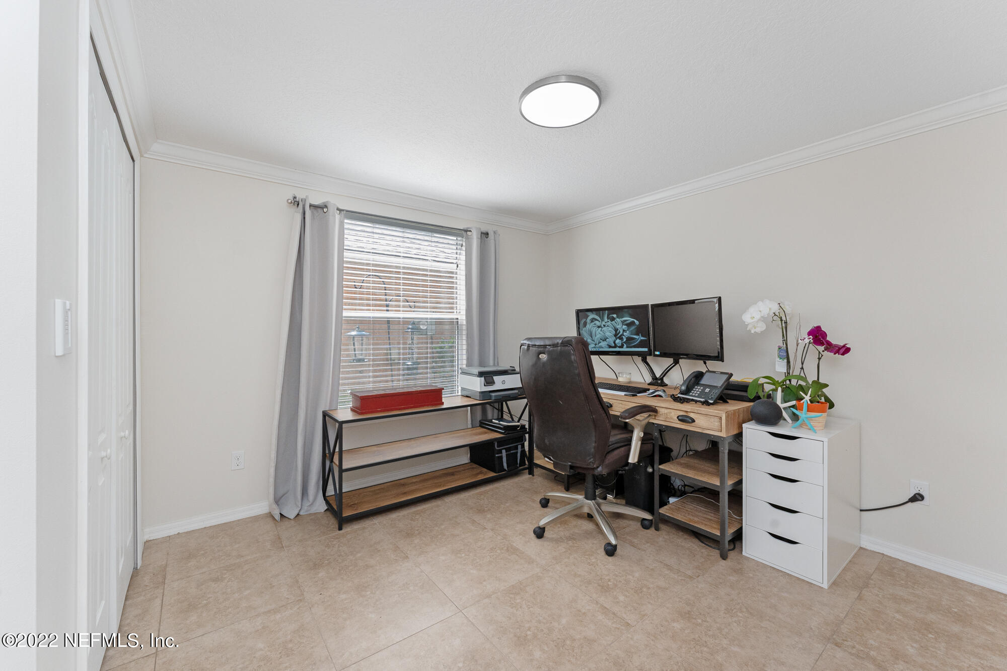 8713 Reedy Branch Drive Jacksonville, FL 32256 - Photo 28 of 38 a work room with furniture and a window