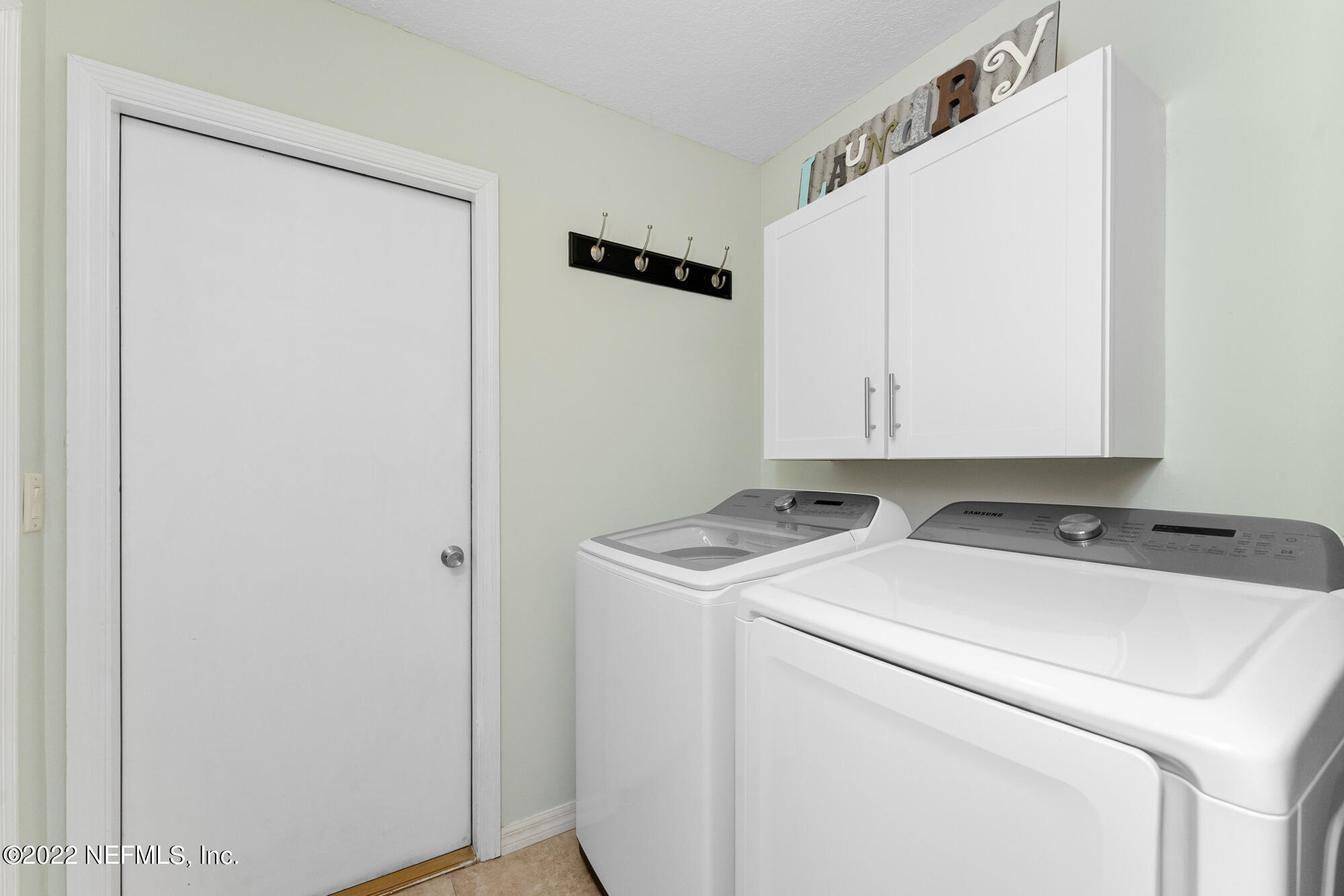 8713 Reedy Branch Drive Jacksonville, FL 32256 - Photo 29 of 38 a utility room with dryer and washer