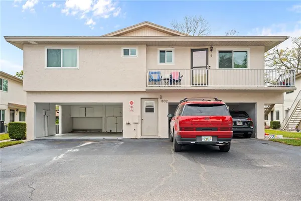 a front view of a house with parking