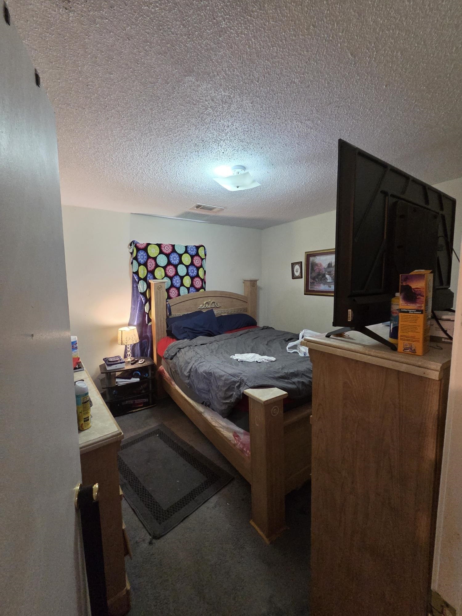 899 West Raines Road Memphis, TN 38109 - Photo 8 of 10 Room featuring wall-to-wall carpeting and a ceiling light fixture