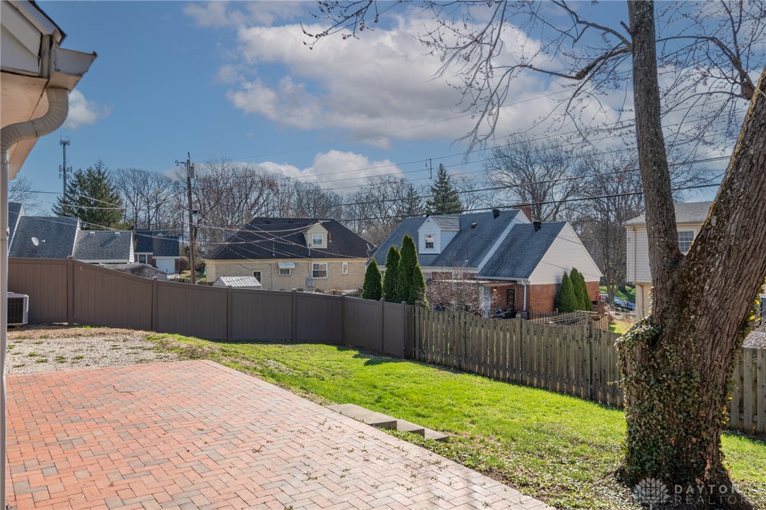 326 North Bromfield Road Kettering, OH 45429 - Photo 27 of 30 This spacious yard offers a perfect blend of paved patio and lush green space.