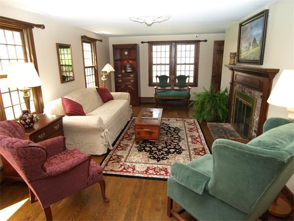69 Teele Road Bolton, MA 01740 - Photo 2 of 17 a living room with furniture and a fireplace