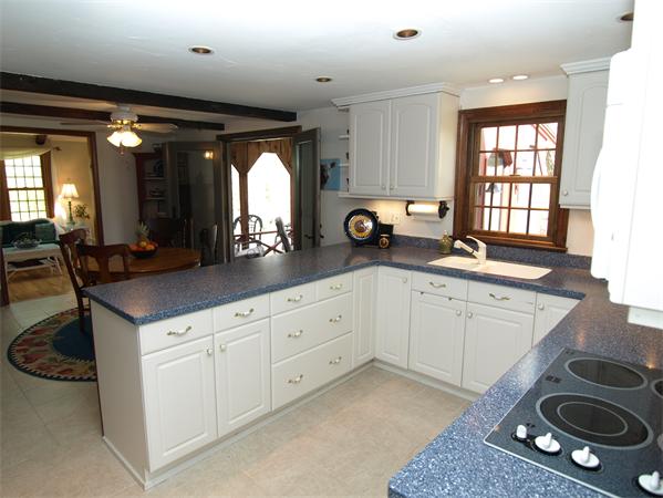 69 Teele Road Bolton, MA 01740 - Photo 4 of 17 a kitchen with a sink stove and cabinets