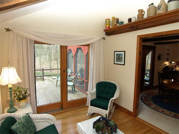 69 Teele Road Bolton, MA 01740 - Photo 6 of 17 a living room with furniture and a floor to ceiling window
