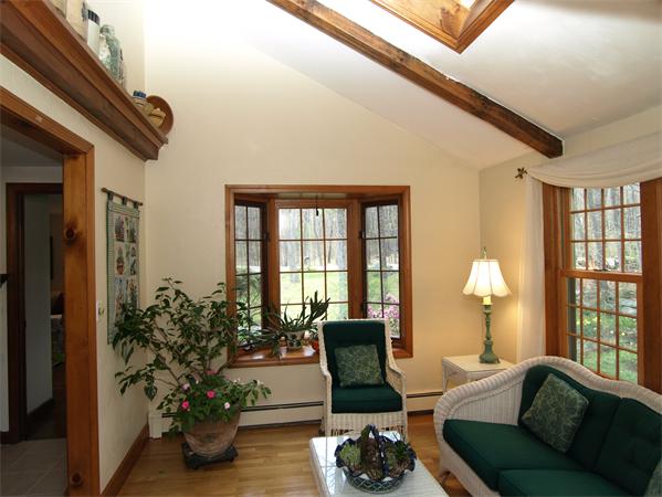 69 Teele Road Bolton, MA 01740 - Photo 7 of 17 a living room with furniture and a potted plant