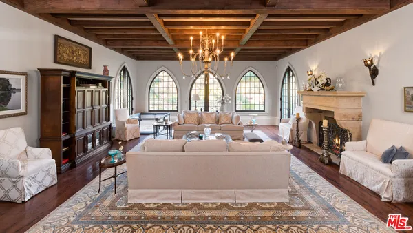 a living room with furniture windows and a fireplace
