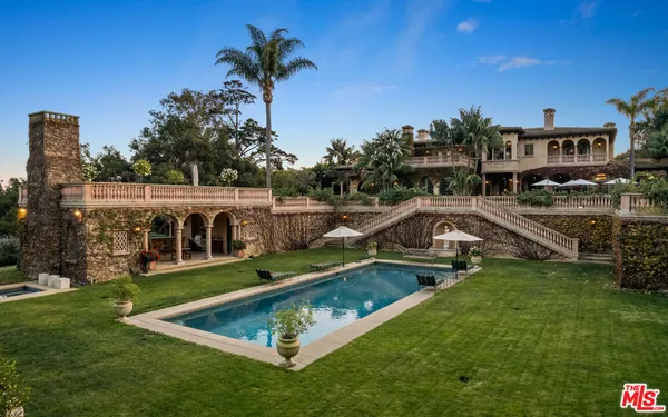 a view of a swimming pool with a patio