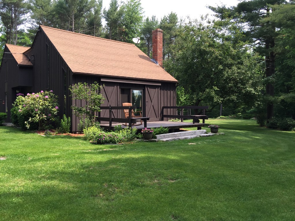 45 Gregory Road Princeton, MA 01541 - Photo 1 of 30 a view of a house with backyard and sitting area