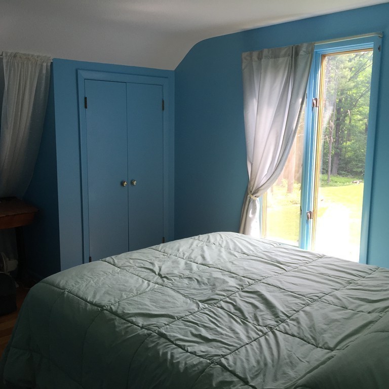 45 Gregory Road Princeton, MA 01541 - Photo 20 of 30 a bedroom with a bed and next to a window