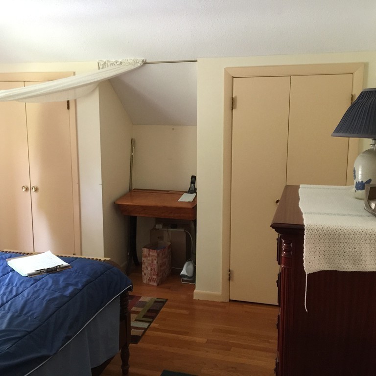 45 Gregory Road Princeton, MA 01541 - Photo 21 of 30 a bedroom with a bed and a table