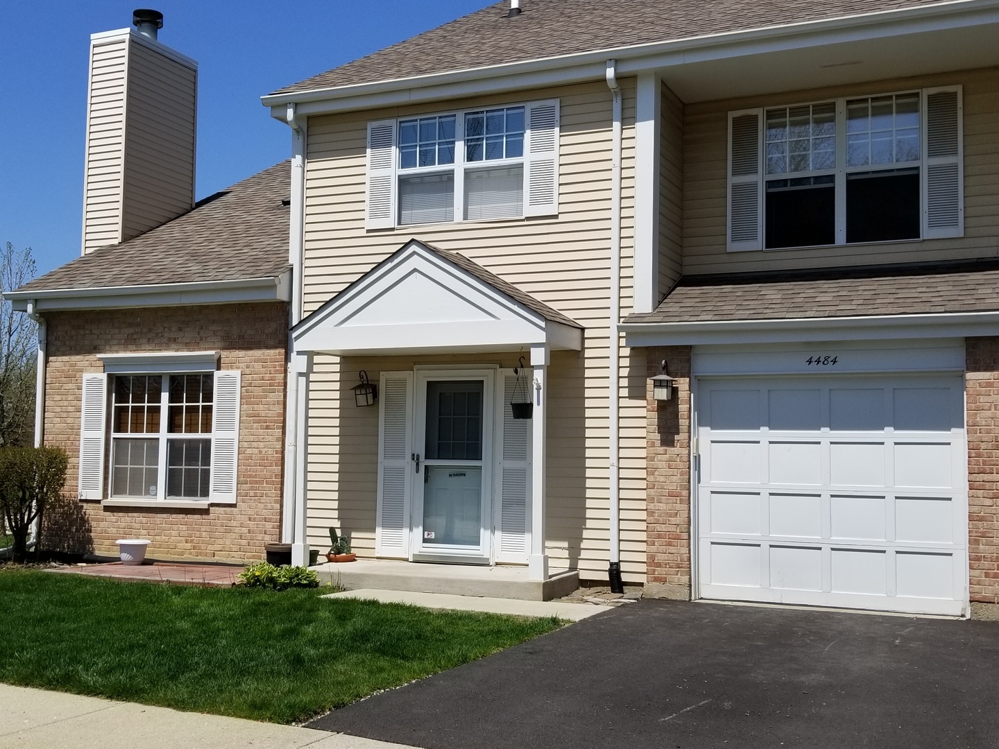 4484 Brookhaven Road Gurnee, IL 60031 - Photo 1 of 13 a front view of a house with a yard
