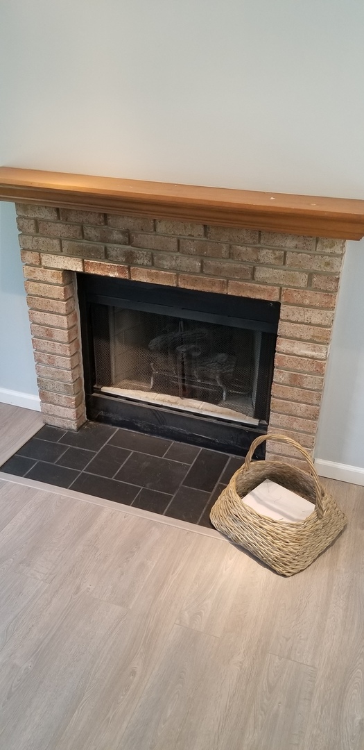 4484 Brookhaven Road Gurnee, IL 60031 - Photo 3 of 13 an empty room with a fireplace