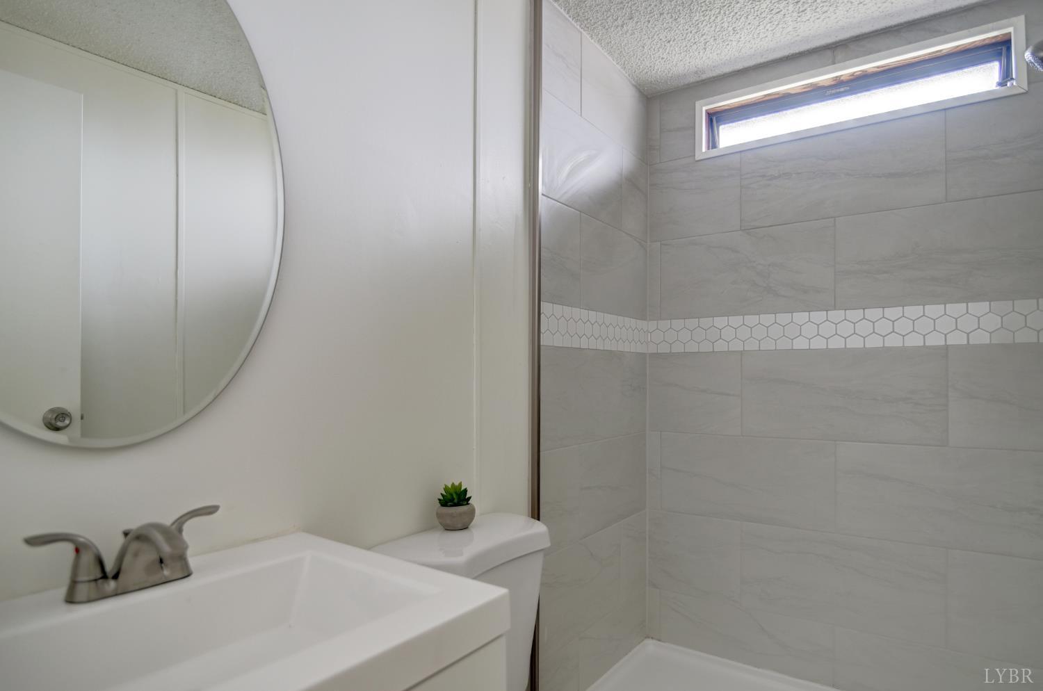 195 Dews Road Hurt, VA 24563 - Photo 20 of 37 a bathroom with a sink and a mirror