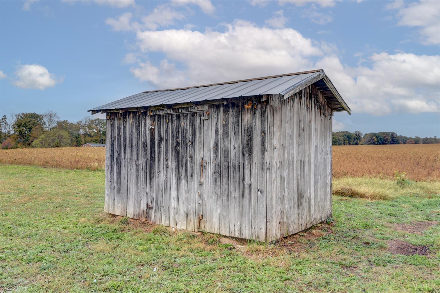 195 Dews Road Hurt, VA 24563 - Photo 29 of 37 a backyard of a house with lots of green space and fence