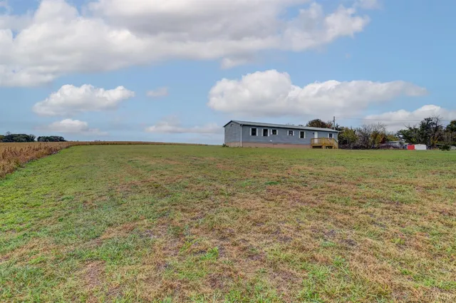 a front view of house with yard and street
