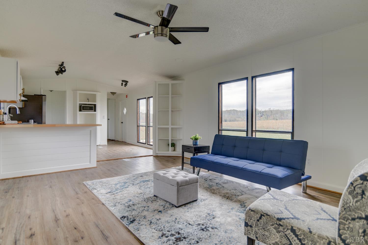 195 Dews Road Hurt, VA 24563 - Photo 4 of 37 a living room with furniture and a large window