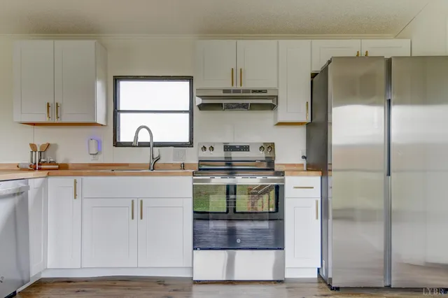 a kitchen with a sink and a refrigerator