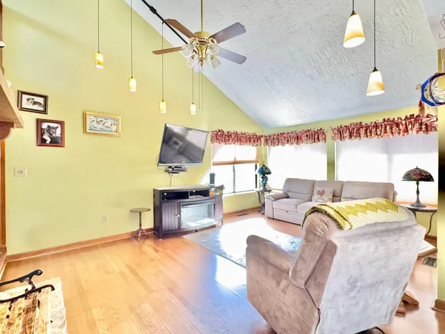 a view of a chairs and table in the balcony
