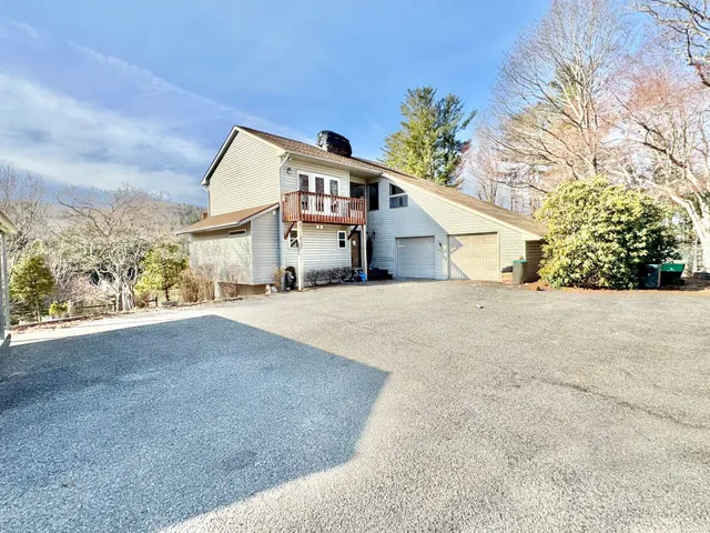 a living room with fireplace furniture and a flat screen tv