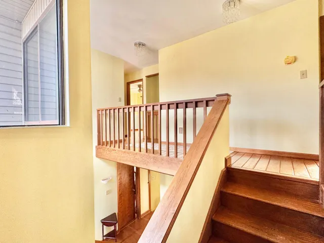 a view of a forest with mountains in the background
