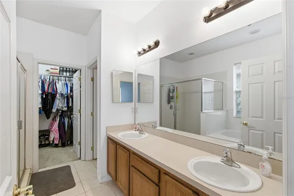 a bathroom with a sink double vanity and a mirror