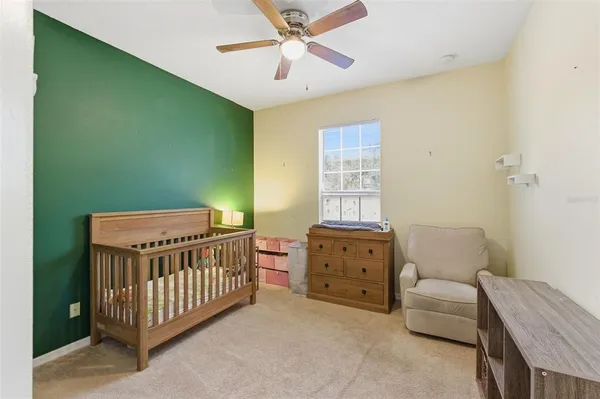 a bedroom with a bed and a couch