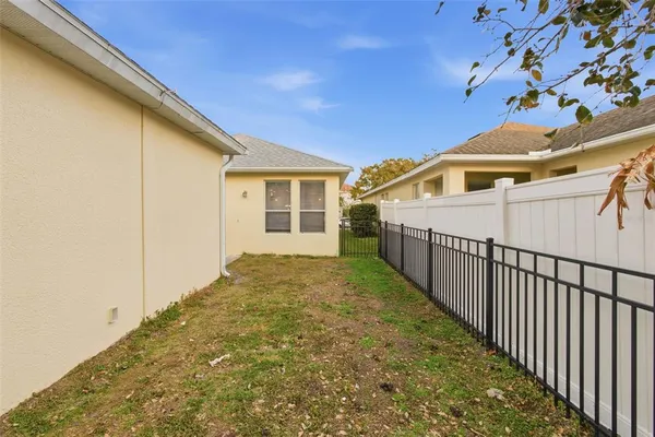 a view of a house with a backyard