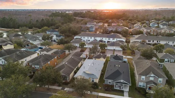 an aerial view of residential building with green space