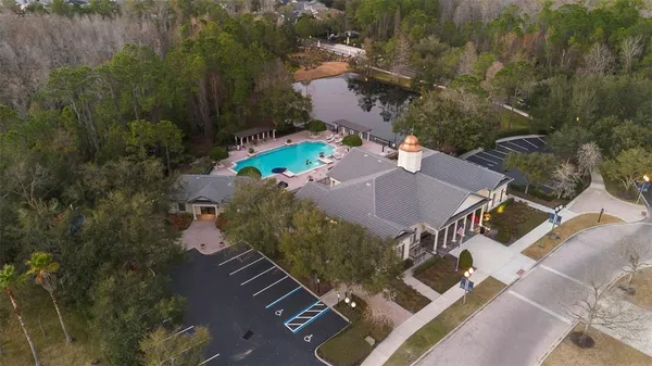 an aerial view of a house with yard swimming pool and outdoor seating