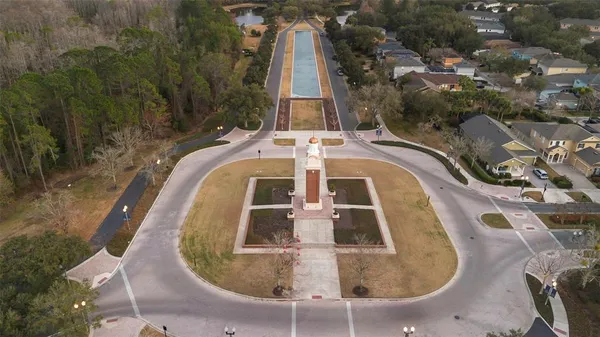 an aerial view of a house with a yard