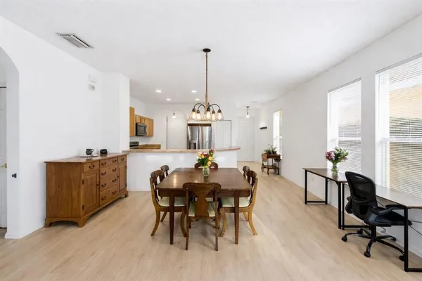 a view of a dining room with furniture window and outside view