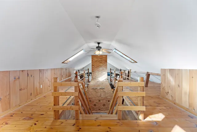 a view of an chairs and table in a room